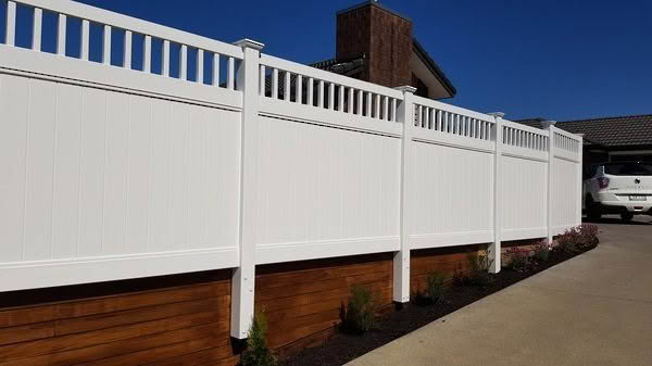 Epsom PVC privacy fence with trellis top, 1830mm high x 2400mm wide panel. Available in white or with grey insert panels. Angled view perspective, suitable for residential properties.