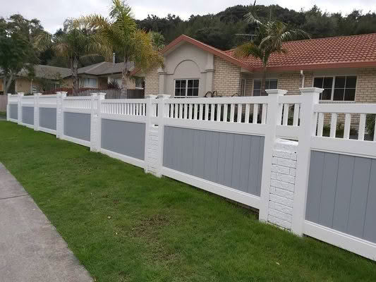 Epsom PVC privacy fence with trellis top, 1830mm high x 2400mm wide panel. Available in white or with grey insert panels. Modern home installation, stylish and durable.