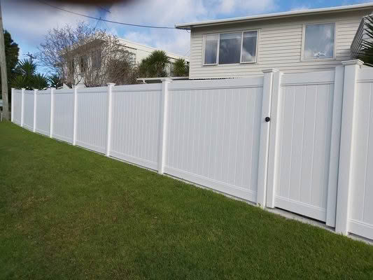 Metro PVC full privacy fence in white or grey, 1830mm high x 2400mm wide panel, durable and low-maintenance. Angled view perspective, suitable for New Zealand conditions, can be stepped or sloped.