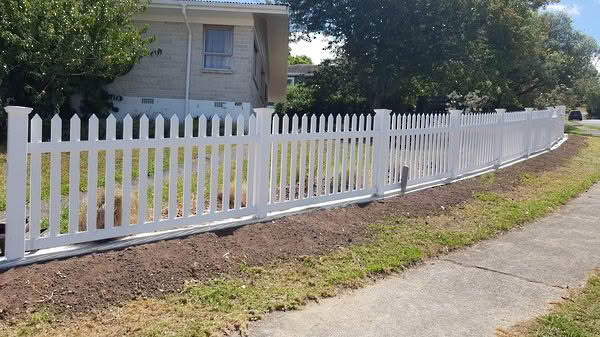 Villa PVC picket fence, 1200mm high x 2400mm wide panels. Provides a classic look with pickets centred through top and bottom rails, ensuring the same style on both sides. Displayed in angled view, low-maintenance and available with matching gates.
