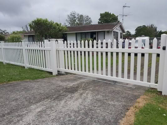 Villa PVC picket fence, 1200mm high x 2400mm wide panels. Provides a classic look with pickets centred through top and bottom rails, ensuring the same style on both sides. Shown with matching gate, low-maintenance and available in multiple gate sizes.